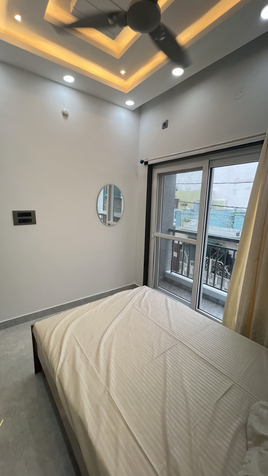 Bedroom with window and balcony